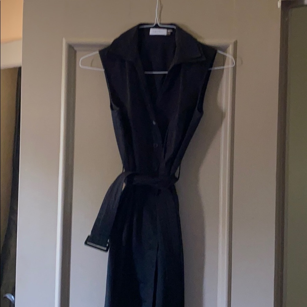 Black sleeveless shirt dress.